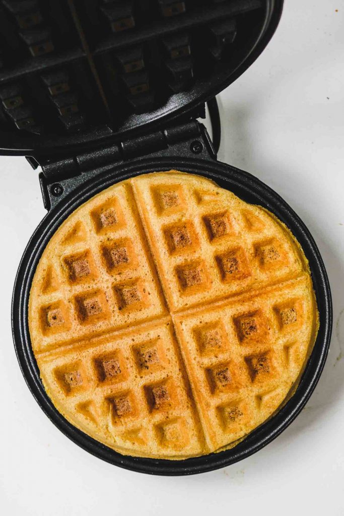 cornbread waffles on a waffle iron finished