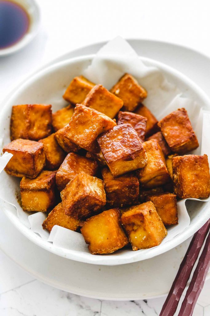 close up shot of crispy tofu in a bowl 