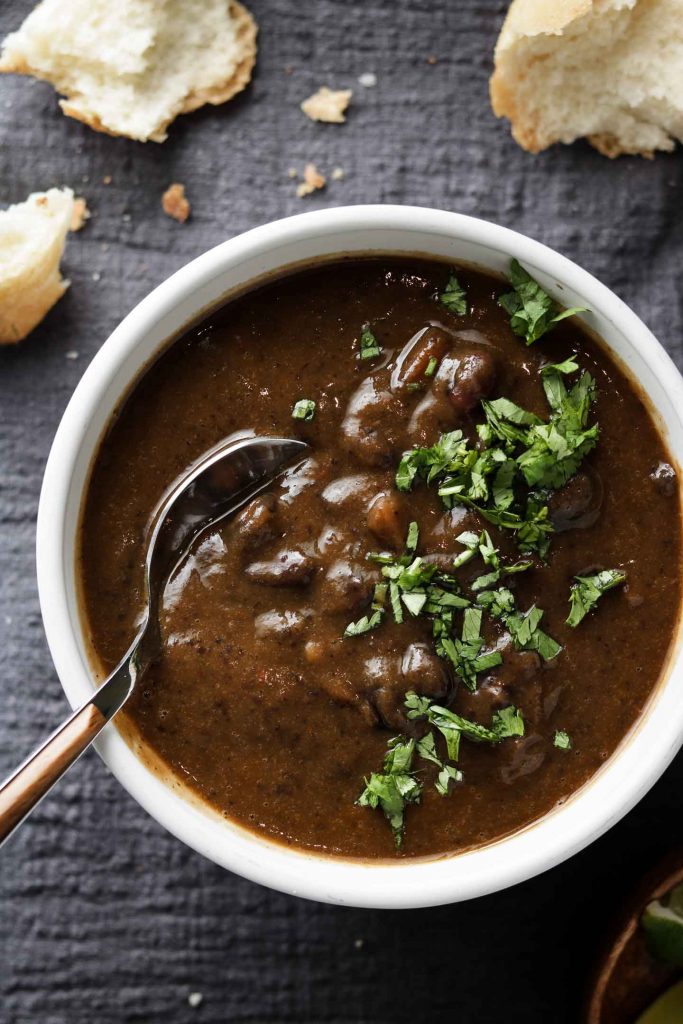 black bean soup in a bowl with bread