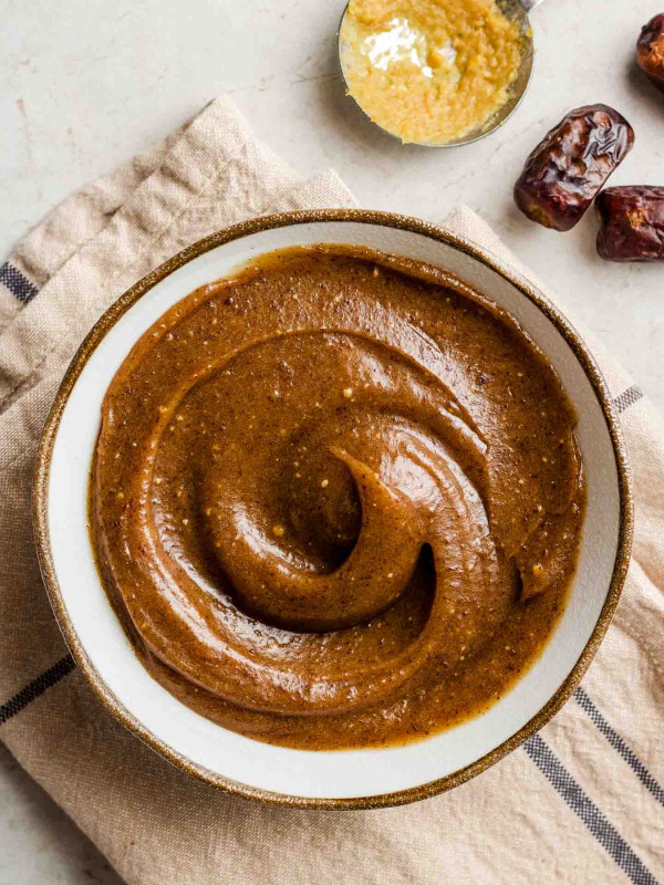 salted date caramel sauce in a bowl with a swirl top shot