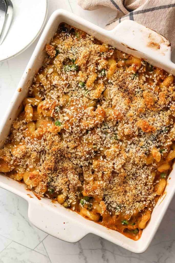 healthy dairy free gluten free tuna noodle casserole in a baking dish with breadcrumbs