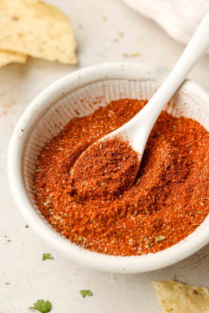 close up shot of chili powder in a white bowl 