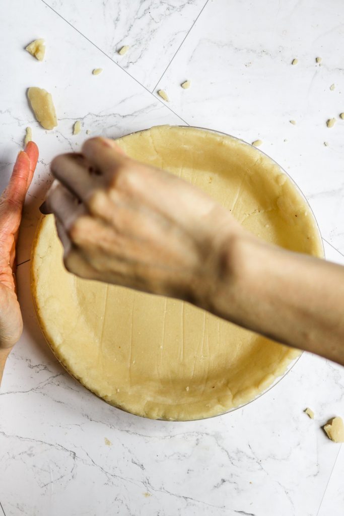 cutting pie crust edges with a knife