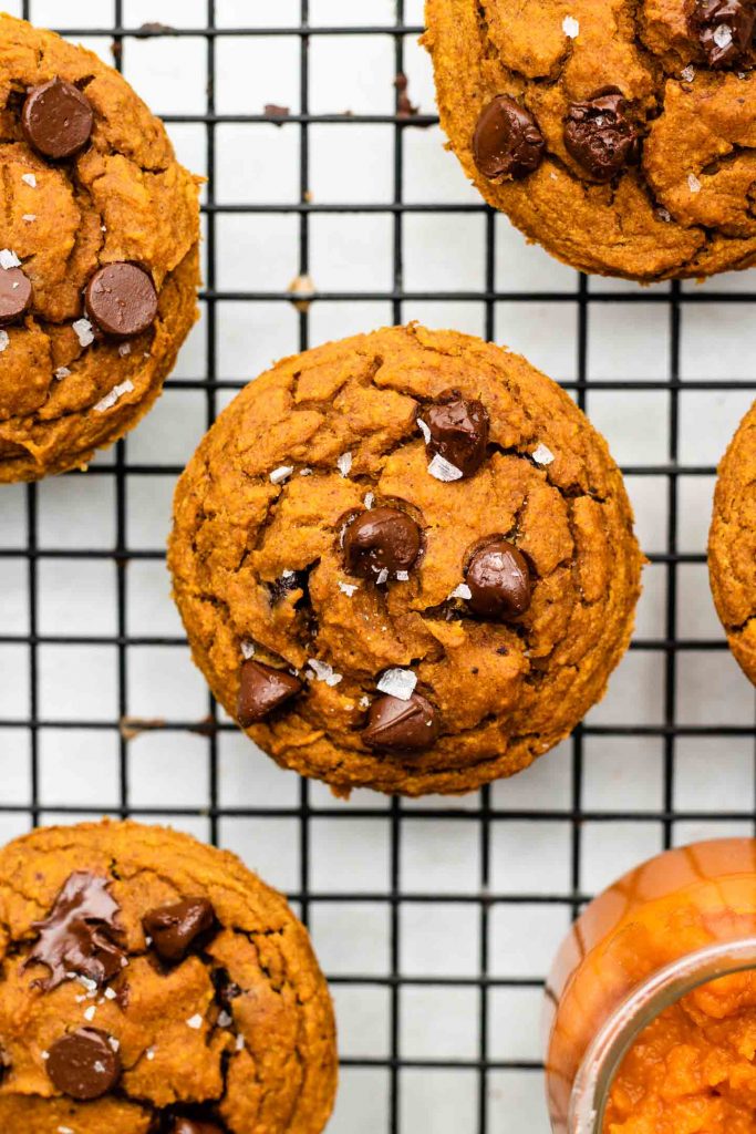 chocolate chip pumpkin muffins on a cooling rack