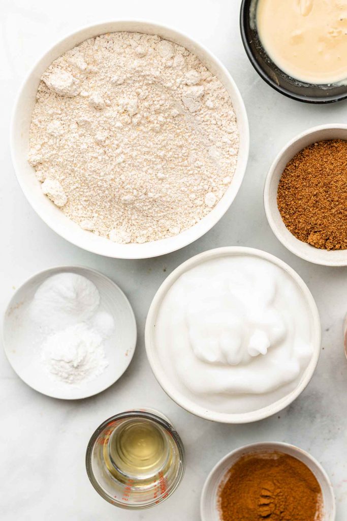 oat flour cinnamon roll ingredients in white bowls