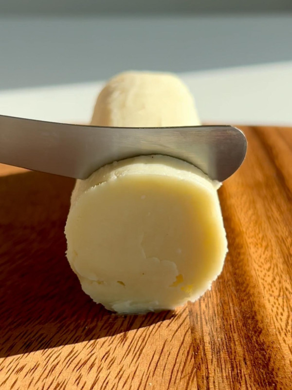 dairy free butter on a brown cutting board