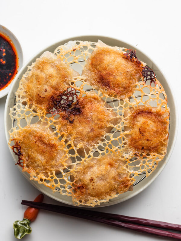 crispy rice paper dumplings with skirt on a wire rack and plate