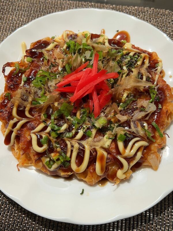 kimchi okonomiyaki on a white plate